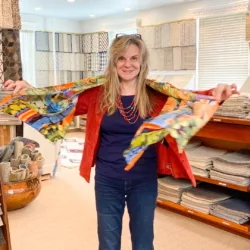 Roz Rustigian in her large Providence rug showroom